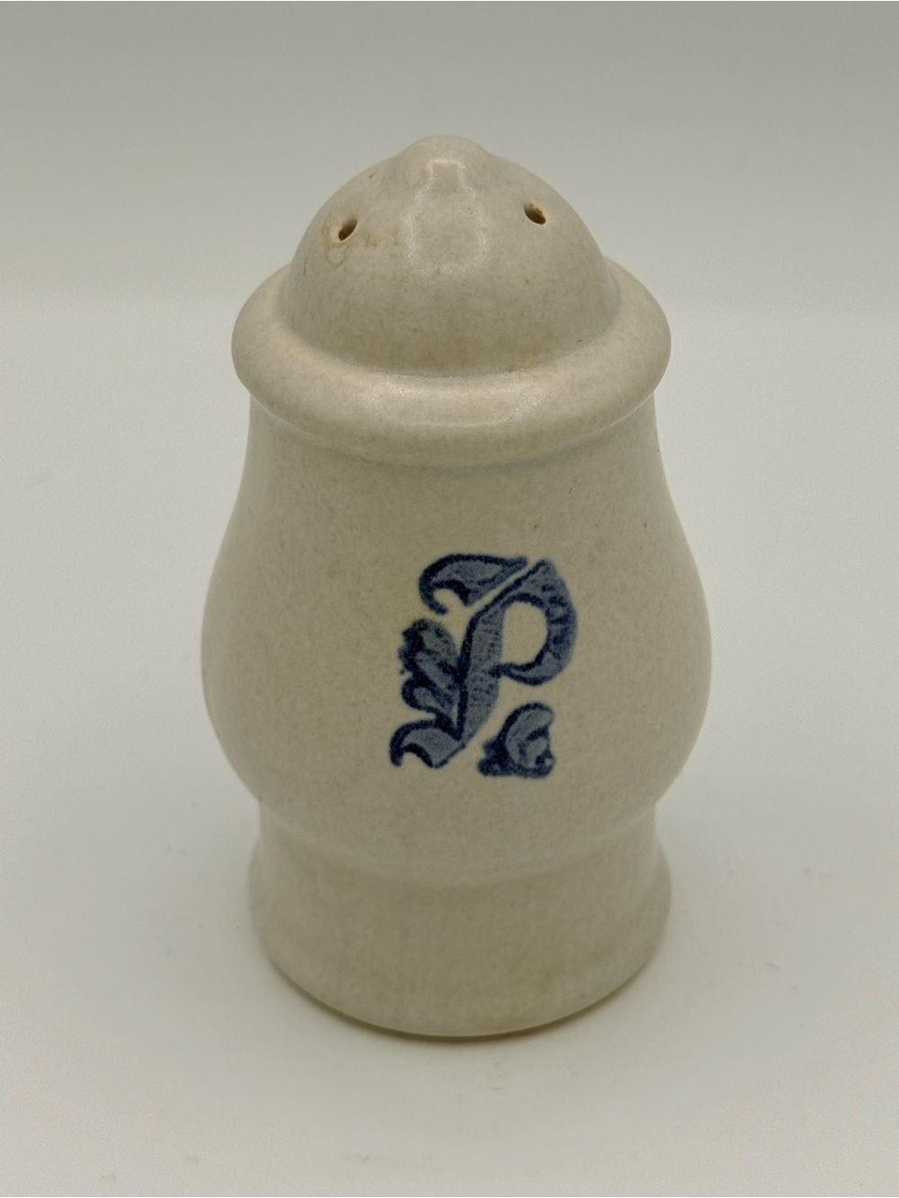 Pfaltzgraff Yorktowne stoneware pepper shaker with blue 'P' monogram.